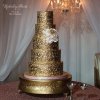 کیک چند طبقه لوکس و شیک جشن ازدواج به رنگ طلایی و با طرح های برجسته