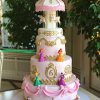 کیک فوندانت جشن تولد دخترانه با تم کراسل (چرخ و فلک اسب دار) و پرنسس های والت دیزنی