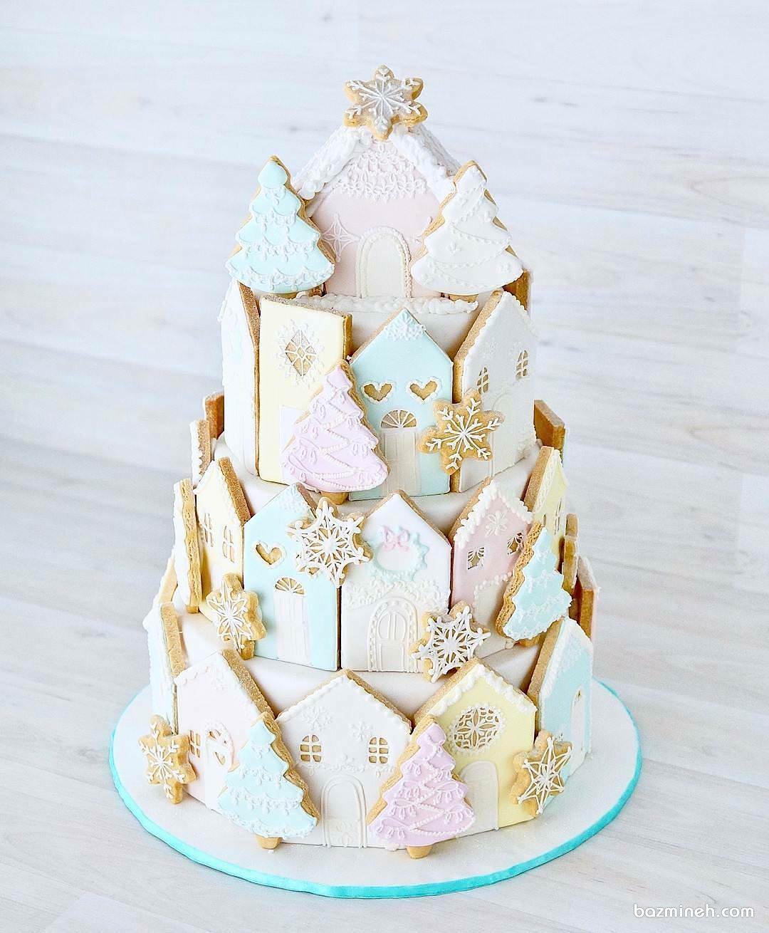 کیک چند طبقه جشن تولد کودک با تم زمستانی تزیین شده با کوکی های ریزه میزه