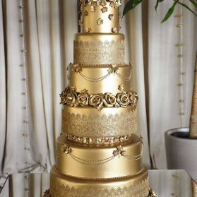 کیک منحصر به فرد و باشکوه جشن نامزدی یا عروسی با تم طلایی