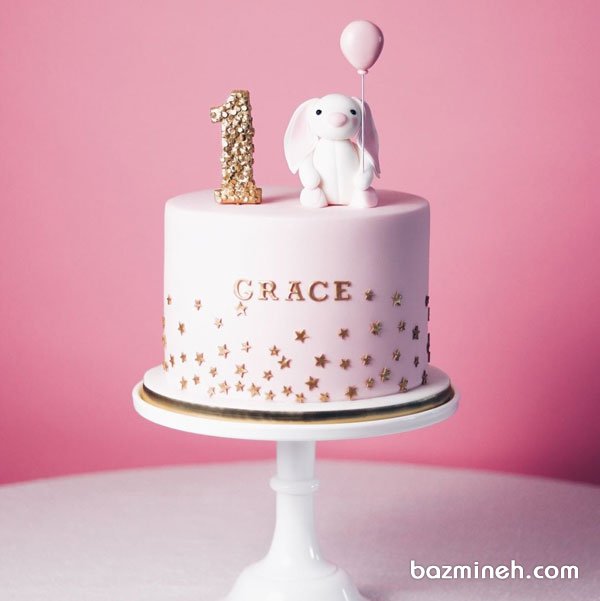کیک فانتزی جشن تولد یکسالگی دخترونه با تم خرگوش صورتی طلایی